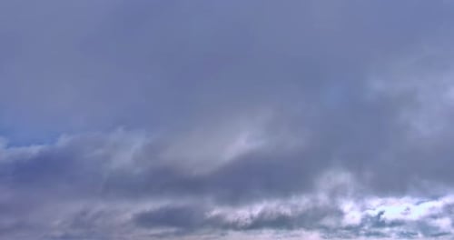 Clouds Drifting Peacefully Across the Blue Sky