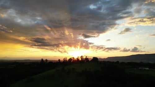Golden Sunset Over Green Rolling Hills