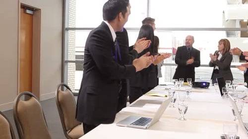 Group of Businesspeople Clapping 35-40