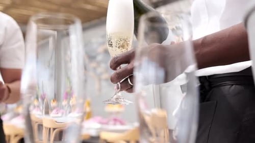 Staff pouring champagne at a function