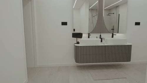 Clean modern bathroom interior design with double sink