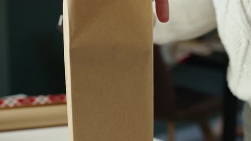 Wrapping a Christmas Gift with Brown Paper