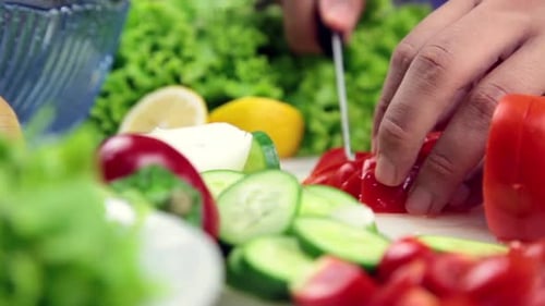 Man Making Salad in Kitchen