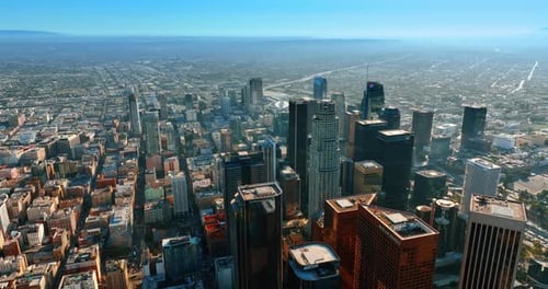 Flight over the roofs of skyscrapers in the downtown of Los Angeles, California, USA