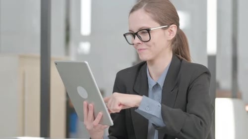 Portrait of Businesswoman Celebrating Success on Tablet