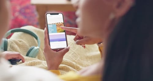 Couple, phone and travel app in home for holiday booking online