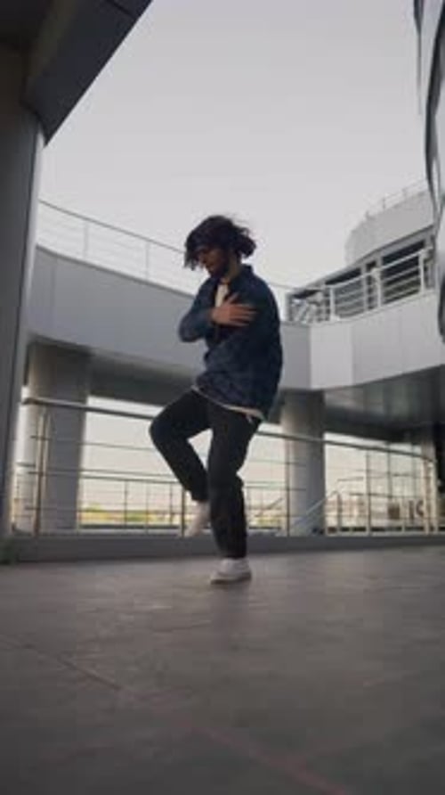 Vertical Video Stylish Male Street Dancer Dancing Hip Hop on Urban Background