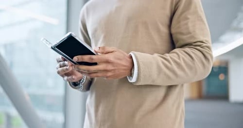 Hands of man on smartphone, typing in office and technology for connectivity