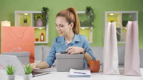 A woman browsing and researching online shopping sites to buy new products.