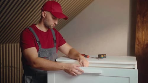 Carpenter Assembling Furniture in Modern Interior with Focus on Quality Craftsmanship