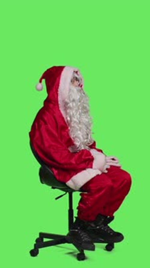 Vertical Video Side View of Santa Claus Embodiment Poses on Chair