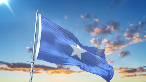 Flag of Somalia Waving in Wind Against Sunny Sky