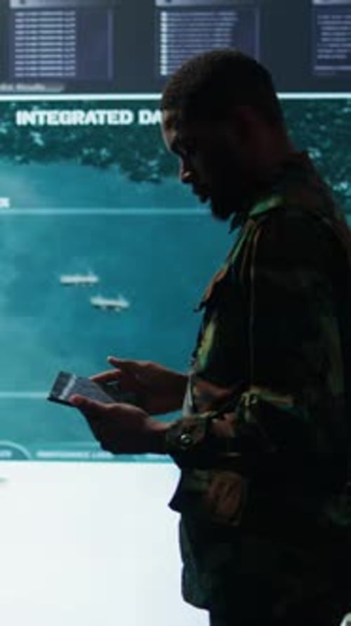 Vertical Video Cybersecurity Specialist Operates in a High Tech Military Control Center