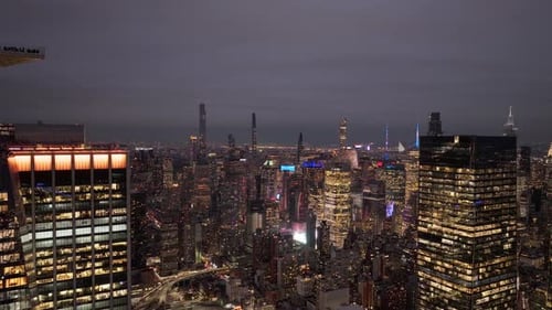 Illuminated Skyscrapers Dominate New York City's Skyline at Night Creating a Breathtaking Urban
