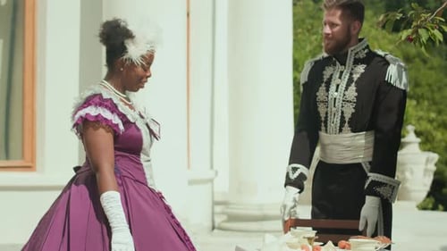 Vintage Fashion Couple Sitting Outdoors