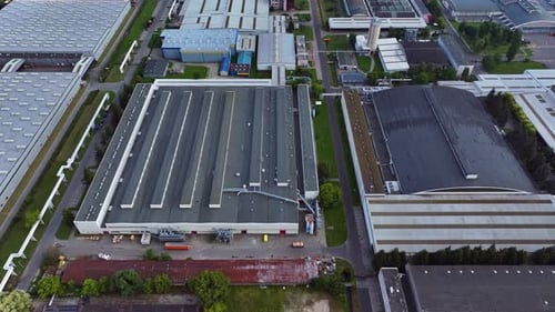 Logistics operations unfold at a vast industrial storage hub in daytime