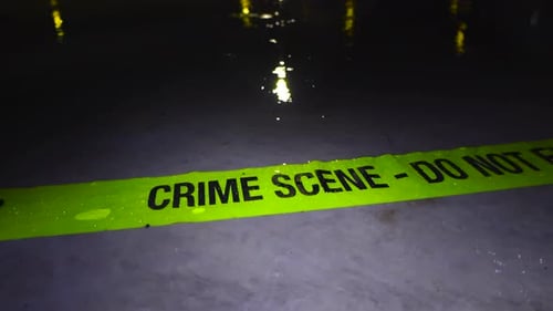Crime Scene Tape at Night in the Rain