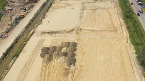 Heavy machinery works of a motorway - Highway Construction. Aerial View