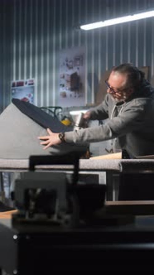 Adult Working on Curved Furniture Upholstery