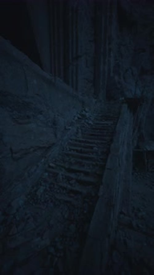 Mysterious Stone Stairs Lead Into the Depths of a Shadowy Cave