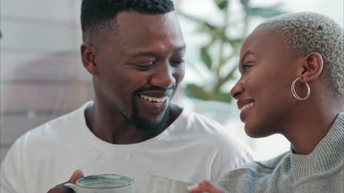 Happy Couple Shares Coffee in Their New Home