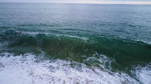 Ocean Waves Crashing Against Rocky Shoreline