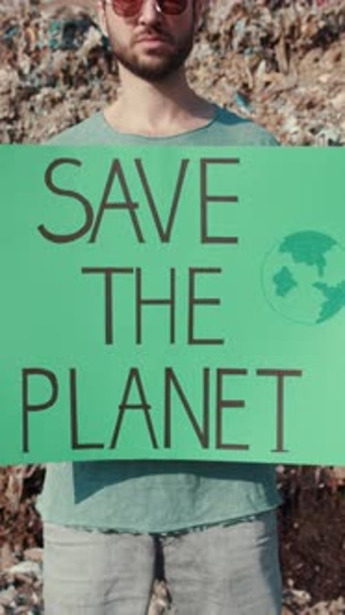 Young Adult Holding 'Save the Planet' Sign