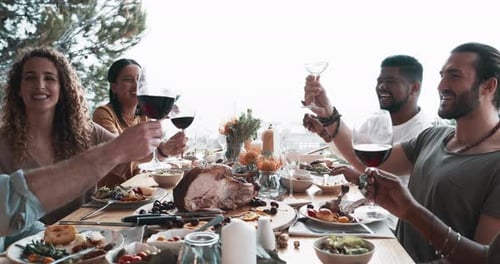 Friends Share Meal and Raise Glasses in Celebration