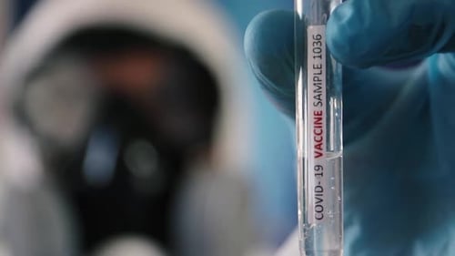 COVID-19 Vaccine Sample Held by Medical Worker