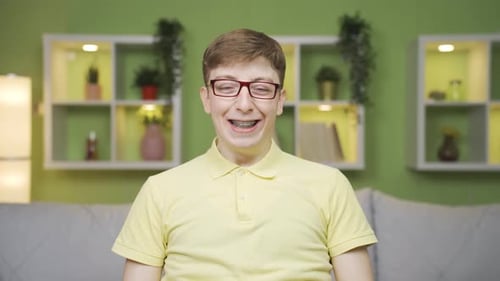 Close-up portrait of cheerful young man.