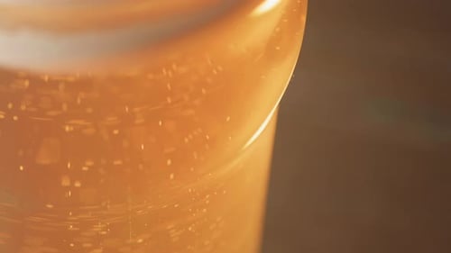 Close Up of Bubbles in Amber Liquid