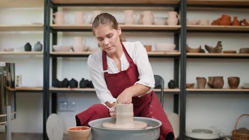Pottery Workshop Woman Ceramist Makes a Pitcher Out of Clay Handicraft Production of Handmade