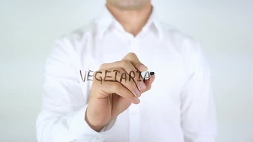 Vegetarian Man Writing on Glass