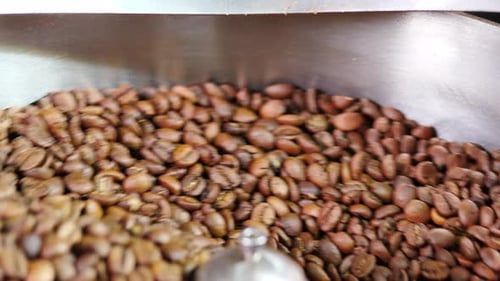 Coffee Beans Roasting and Swirling in Industrial Machine