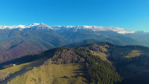 Majestic Mountain Range Under Clear Blue Sky
