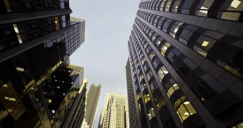 Edificios de gran altura que llegan a las nubes en un entorno urbano al anochecer
