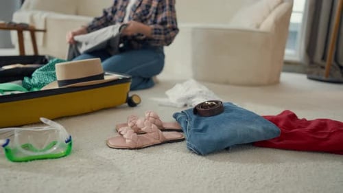 Packaging Suitcase for Travel Clothes on Floor in Living Room Woman Tourist Details View Girl