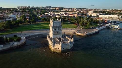 Aerial Drone View of Belem Tower on the Bank of the Tagus River at Sunset Lisbon Portugal
