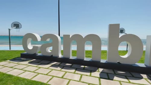 Cambrils beach in Barcelona Catalonia Spain poster white letters anchor view of the turquoise blue s