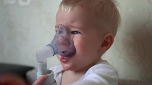 Young Child Using Nebulizer Mask for Treatment