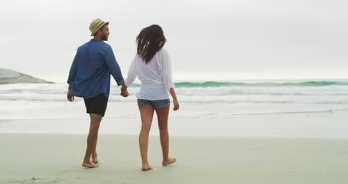 Beach, walking and couple holding hands, running and bonding on tropical journey to island water