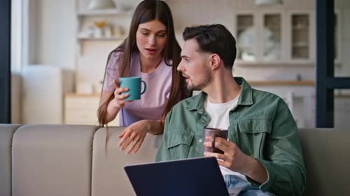 Family Couple Drinking Tea Looking Laptop Studio Closeup Home Pair with Coffee