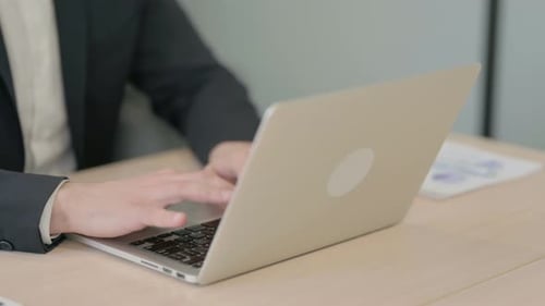 Close up of Male Hands Typing on Laptop