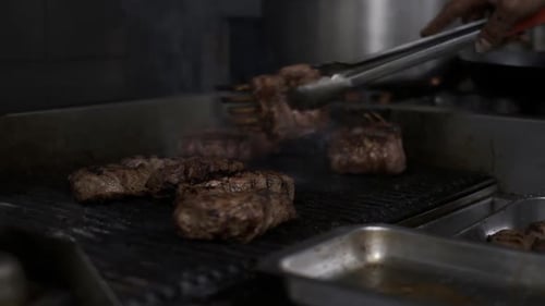 Cooking meat with flames flamed grilled meat. Steak on the grill, Cooking steaks.