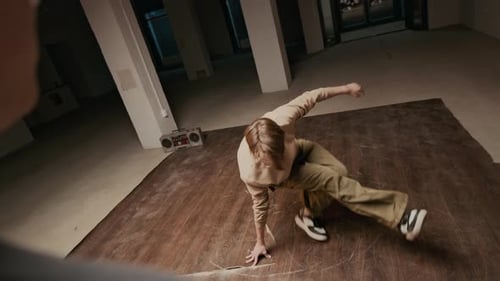 Blond Haired Young Man Breakdancing in Urban Space