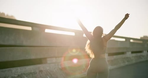 Woman Stretching on Overpass at Sunset