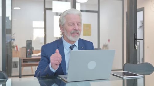 Senior Man on Video Call Waving and Talking