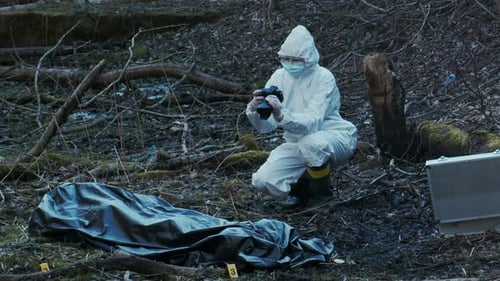 Forensic Specialist Working in the Forest Police Criminalists Collecting Evidence and Making