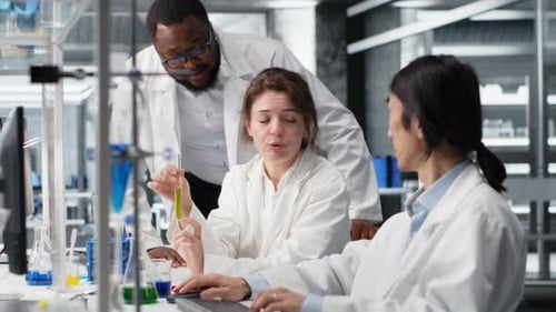 Multiethnic Research Facility Team Using Colorful Chemical Solutions