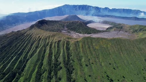 Wide Aerial Pullback of Mount Bromo, Mount Batok, and Tengger Caldera, Indonesia